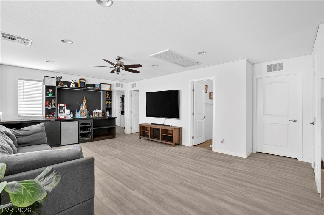 6281 Angora Peak Lane Las Vegas, NV 89115 - Photo 23 of 34 The ample living space features clean lines and practical wood-like flooring.