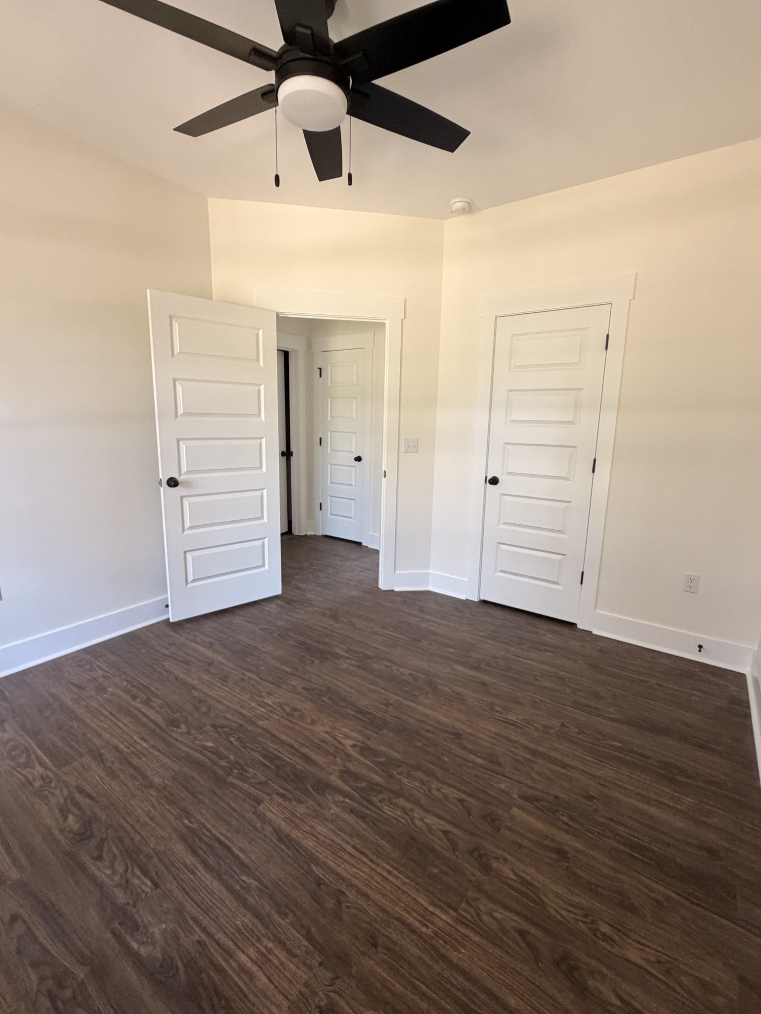 527 Old Hopkinsville Road Cadiz, KY 42211 - Photo 16 of 31 an empty room with wooden floor and windows