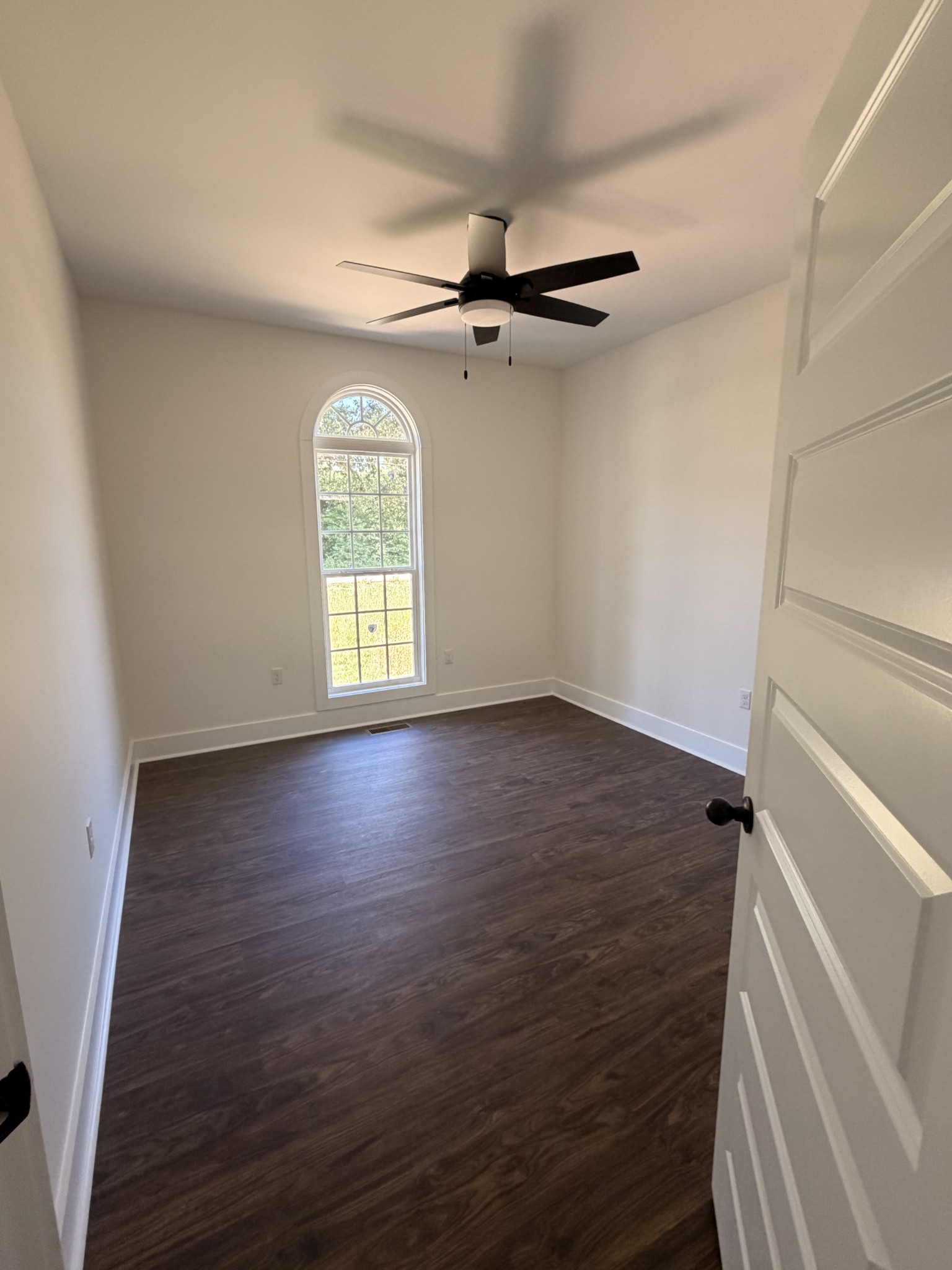 527 Old Hopkinsville Road Cadiz, KY 42211 - Photo 17 of 31 an empty room with wooden floor cabinet and windows