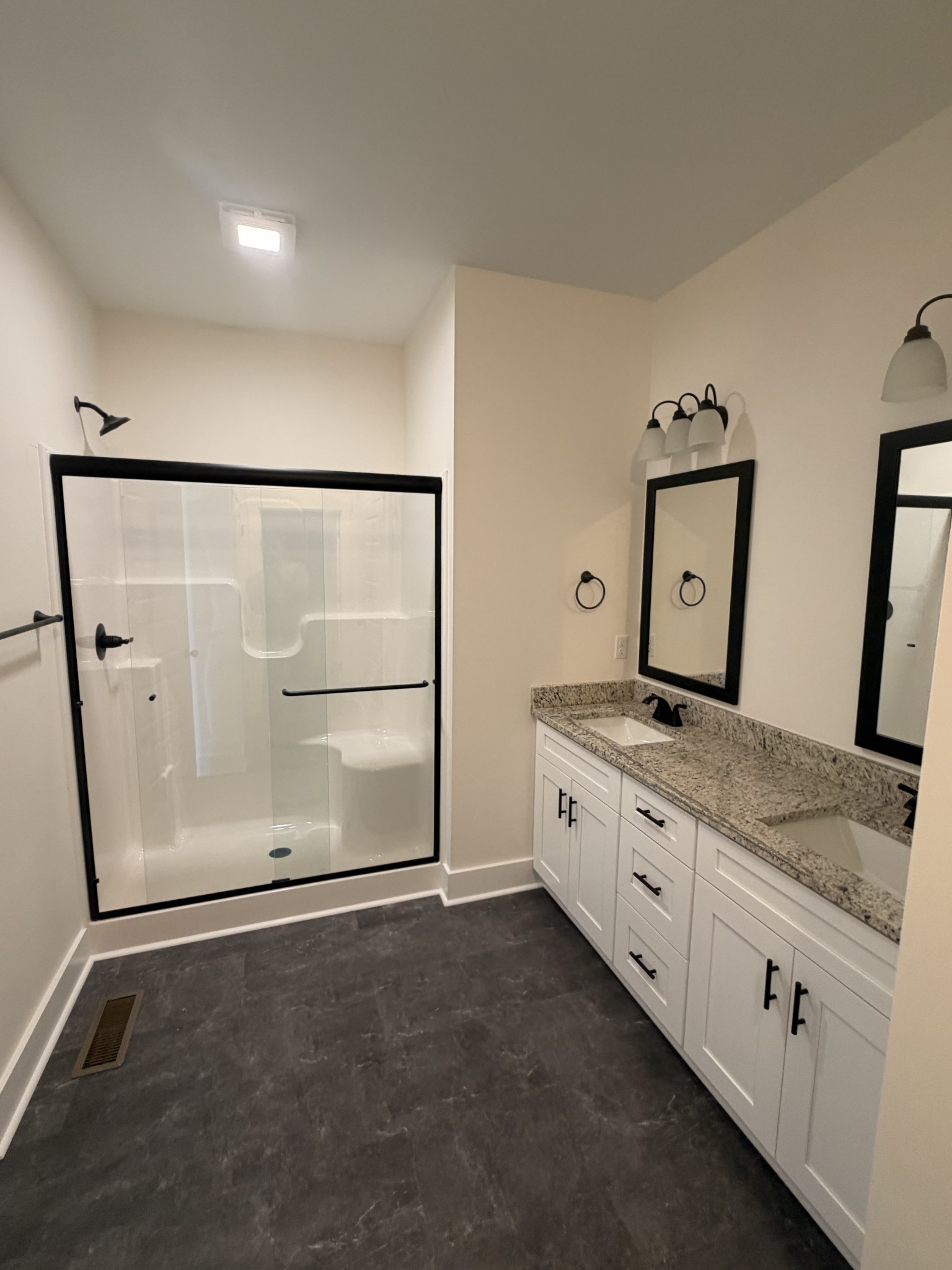 527 Old Hopkinsville Road Cadiz, KY 42211 - Photo 24 of 31 a spacious bathroom with a granite countertop sink a mirror and a shower