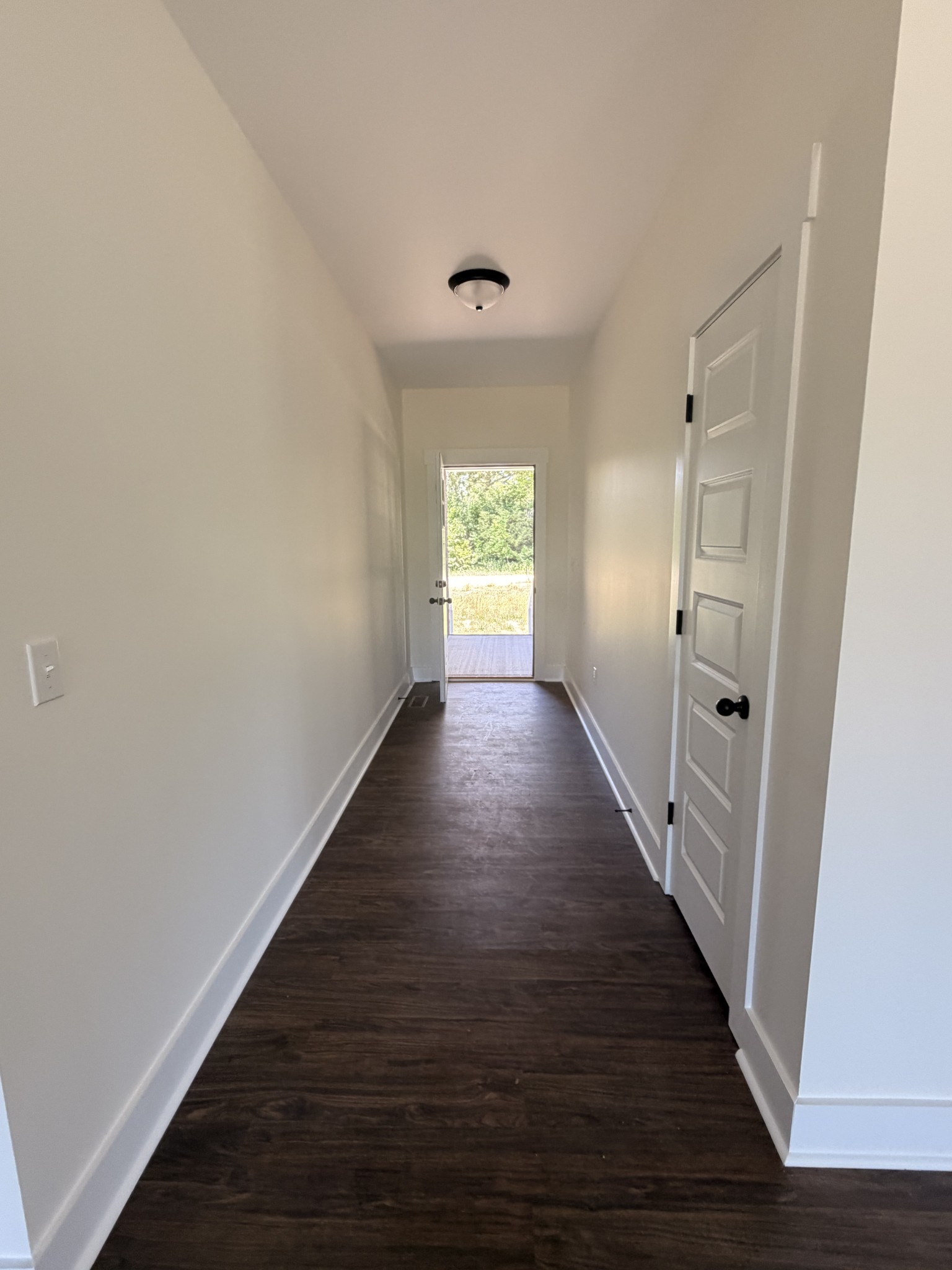 527 Old Hopkinsville Road Cadiz, KY 42211 - Photo 10 of 31 a view of a hallway with wooden floor