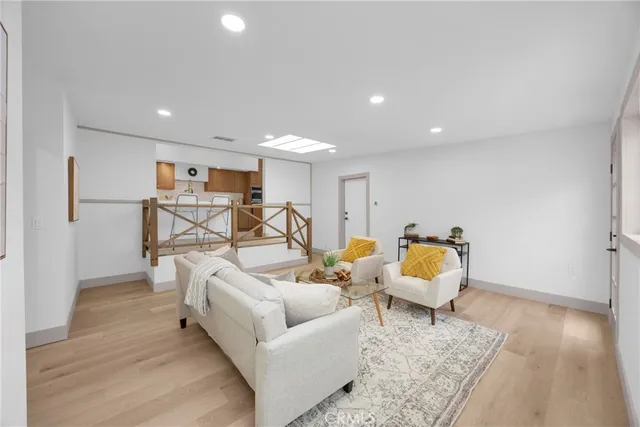 a living room with furniture flowerpot and window