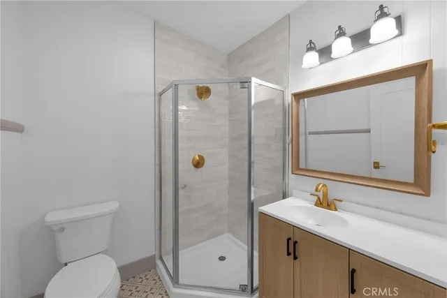 a bathroom with a sink vanity and mirror