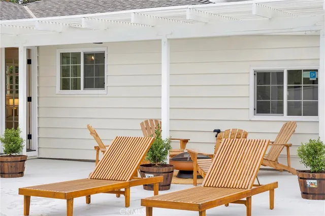 a front view of a house with a garden and plants
