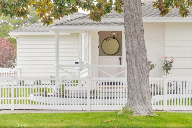 an aerial view of residential houses with outdoor space and swimming pool
