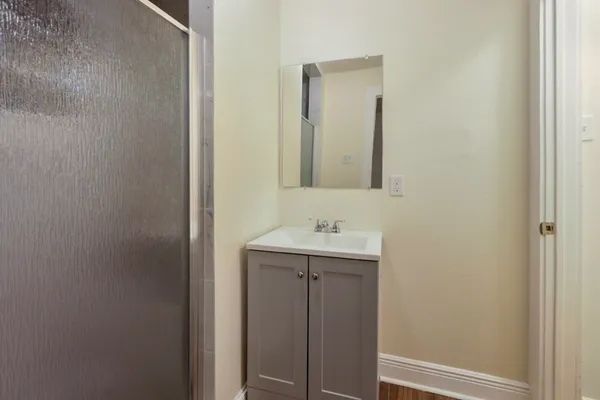 a bathroom with a sink and mirror