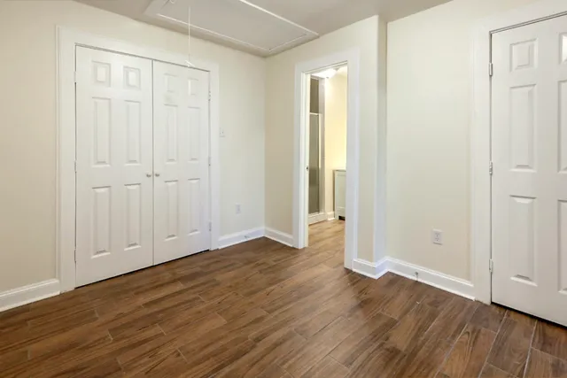 an empty room with wooden floor