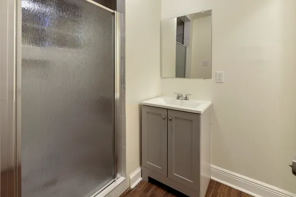 a bathroom with a sink and a mirror