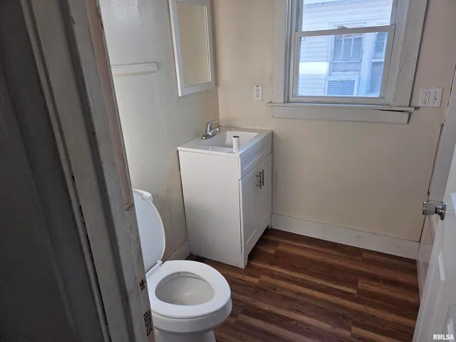 a bathroom with a sink and toilet