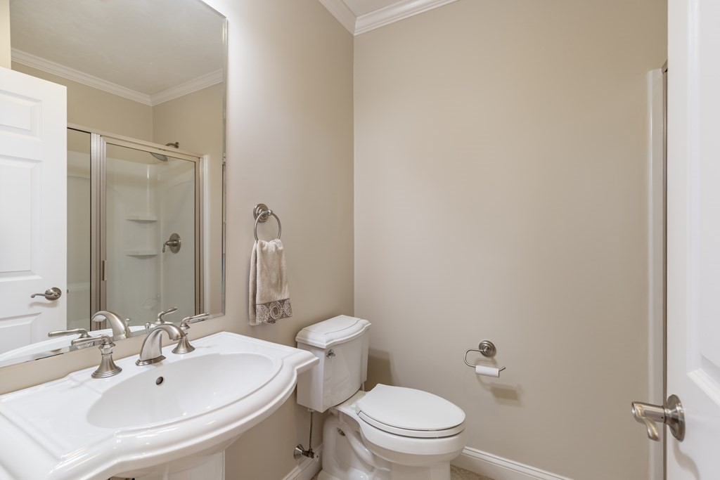 22 English Commons: 12 Boston Street, Unit 22 Topsfield, MA 01983 - Photo 17 of 41 a bathroom with a sink a toilet and shower