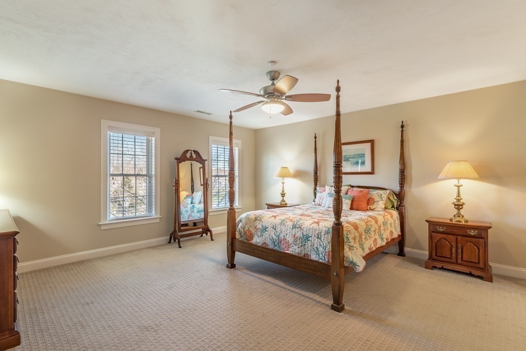 22 English Commons: 12 Boston Street, Unit 22 Topsfield, MA 01983 - Photo 20 of 41 a bedroom with a bed and a window