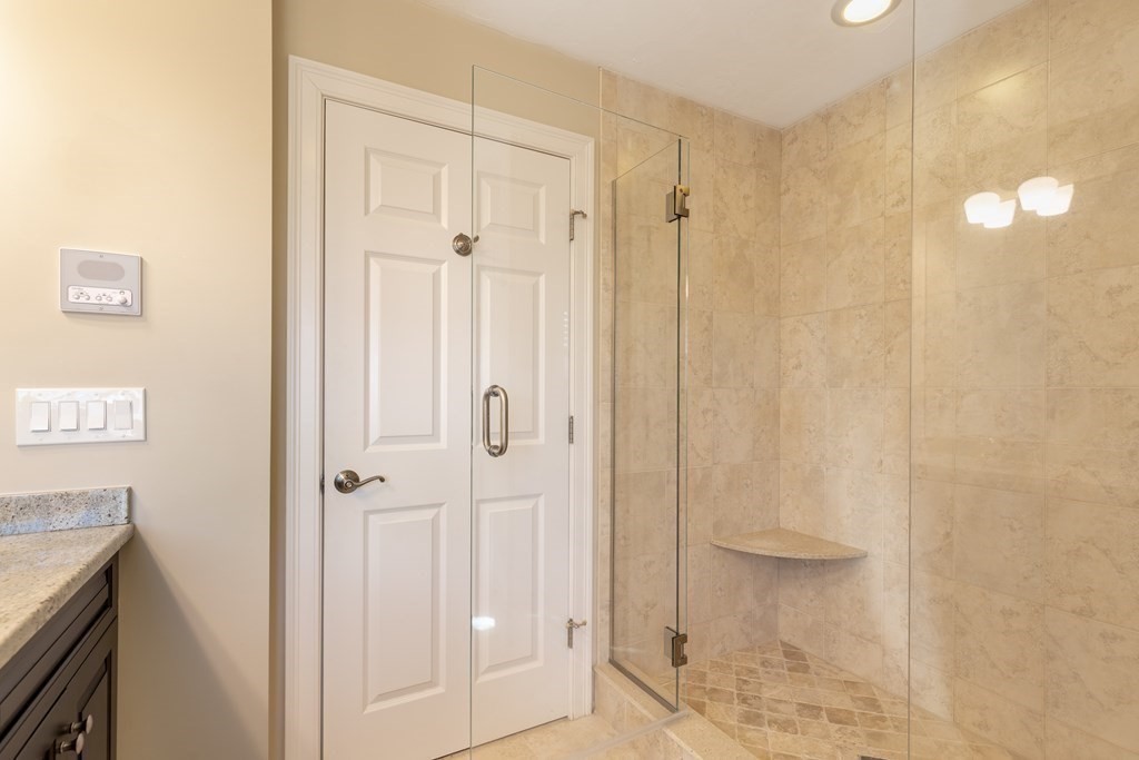 22 English Commons: 12 Boston Street, Unit 22 Topsfield, MA 01983 - Photo 23 of 41 a bathroom with a shower