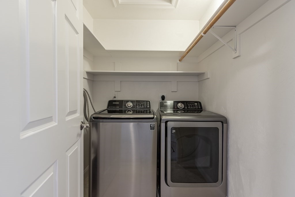22 English Commons: 12 Boston Street, Unit 22 Topsfield, MA 01983 - Photo 26 of 41 a view of a storage and utility room with washer and dryer