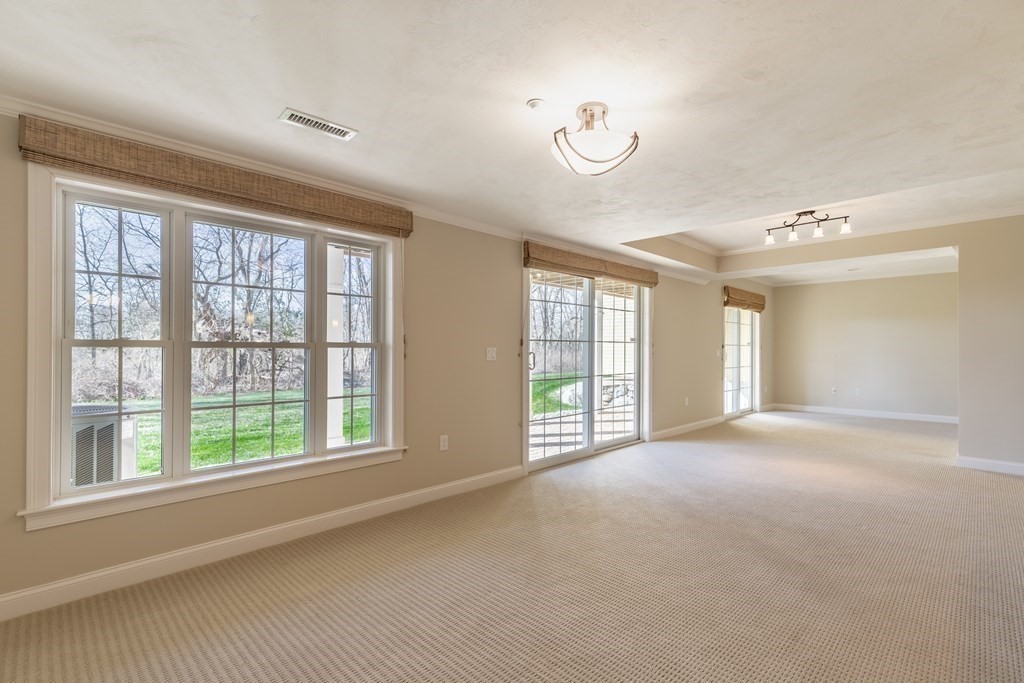 22 English Commons: 12 Boston Street, Unit 22 Topsfield, MA 01983 - Photo 30 of 41 a view of an empty room with a window