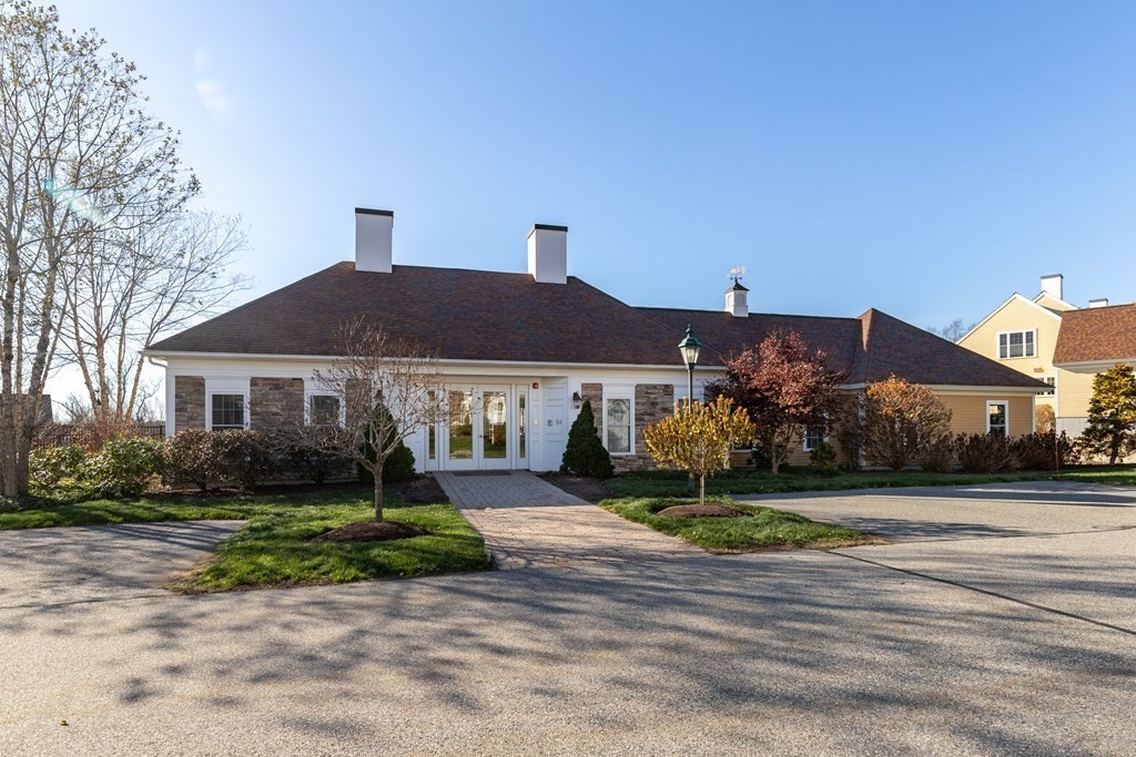 22 English Commons: 12 Boston Street, Unit 22 Topsfield, MA 01983 - Photo 32 of 41 a front view of a house with a yard