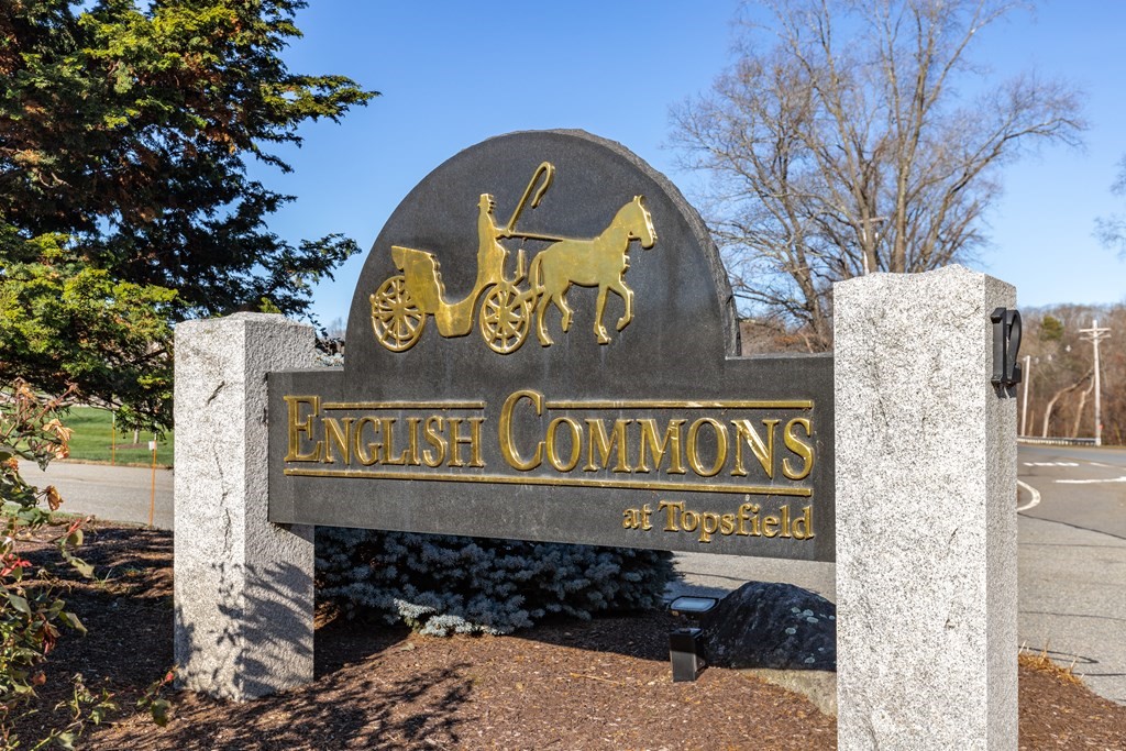 22 English Commons: 12 Boston Street, Unit 22 Topsfield, MA 01983 - Photo 38 of 41 a sign on the side of a building