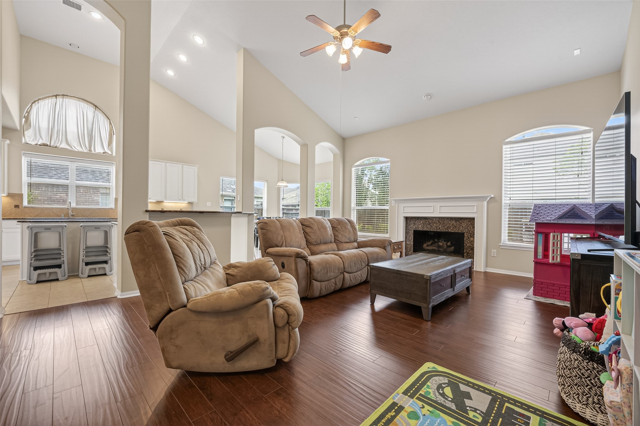 3219 Legends Mist Drive Spring, TX 77386 - Photo 3 of 37 a living room with furniture fireplace and wooden floor