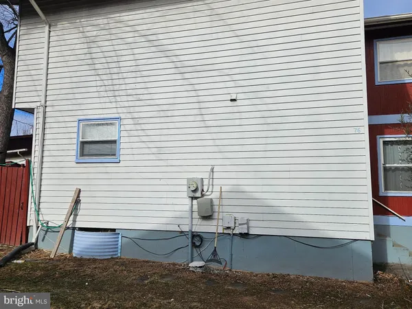 a living room with furniture and flowers