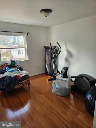 a bed room with two beds and a couch