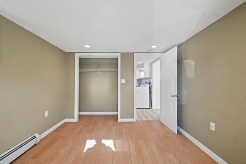 a view of entryway with wooden floor