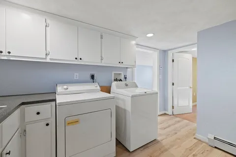 a view of storage and utility room with washer and dryer