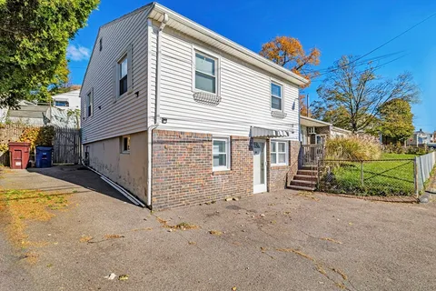 a view of a backyard of the house