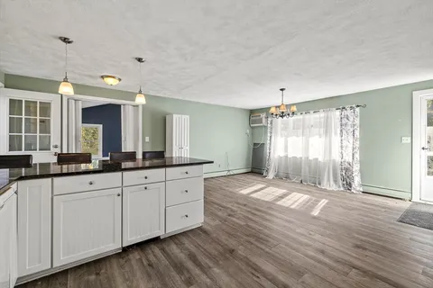 a spacious bathroom with double vanity and a mirror