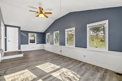 a view of an empty room and window