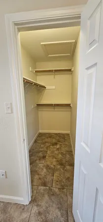 a view of backyard with table and chairs and a large tree