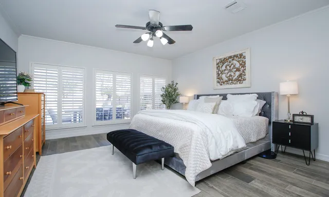 a bedroom with a bed and a couch