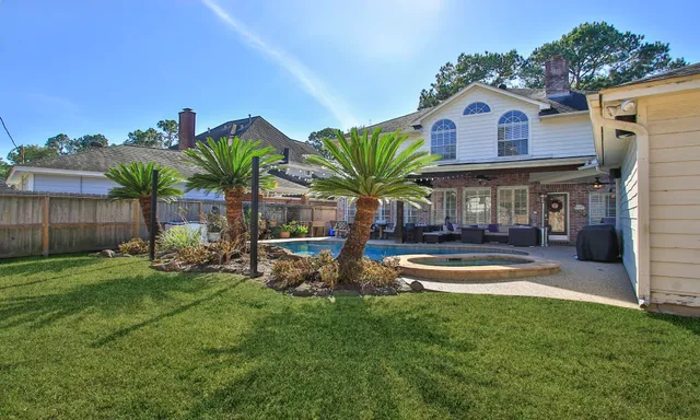 a view of a house with swimming pool