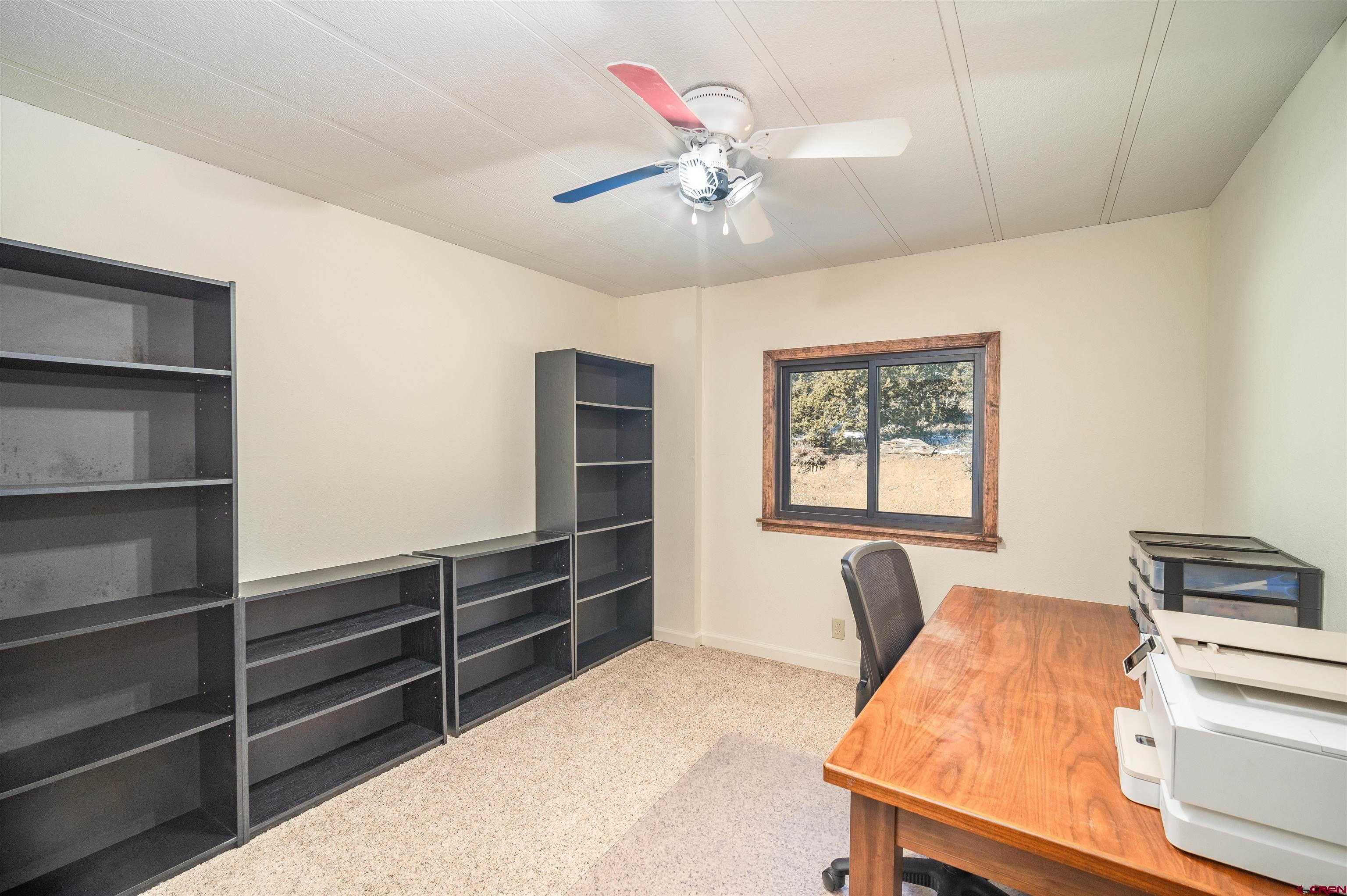 253 Valley Place Durango, CO 81303 - Photo 15 of 26 a workspace with furniture and window