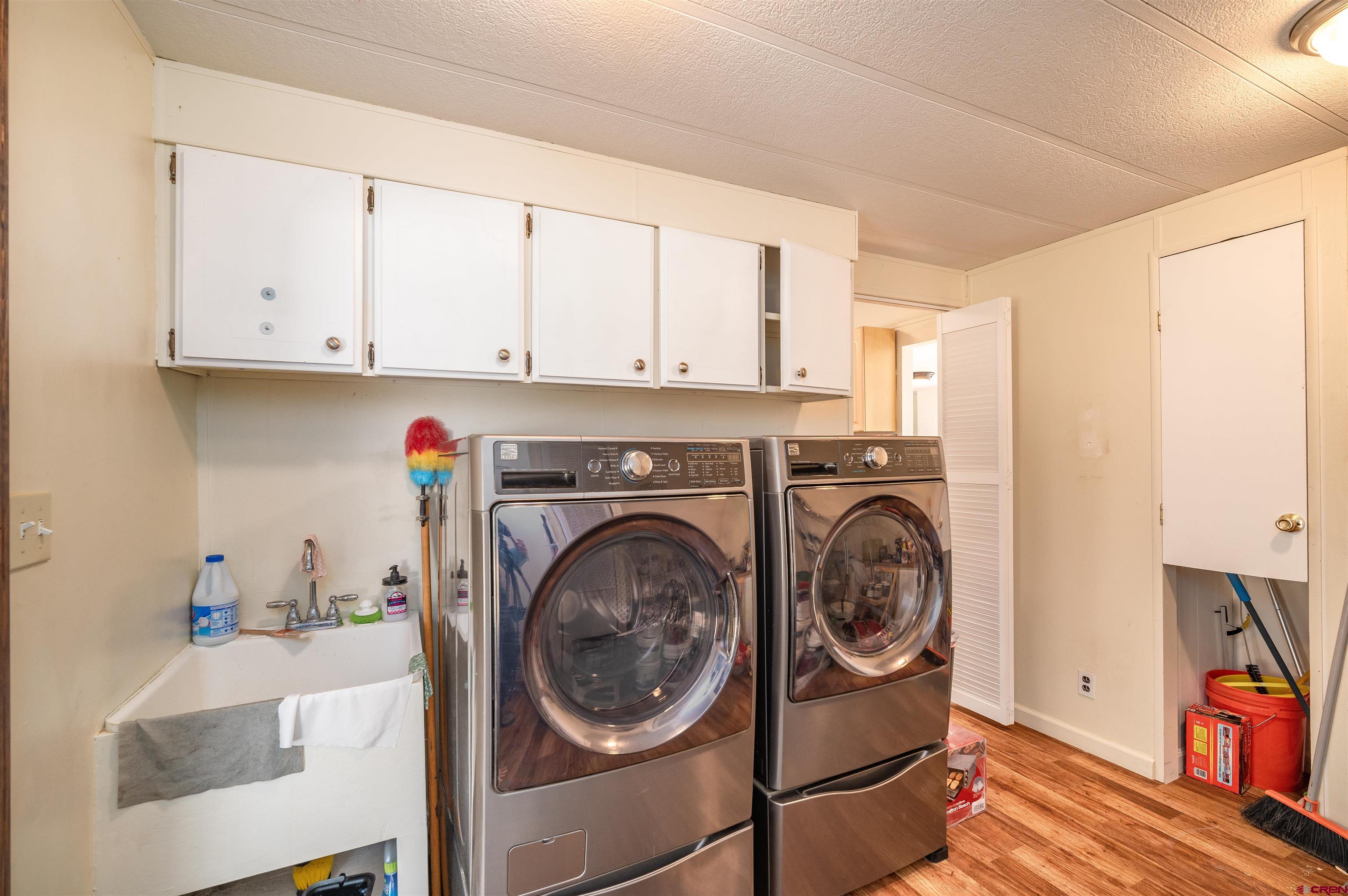 253 Valley Place Durango, CO 81303 - Photo 16 of 26 a view of a kitchen with washer and dryer