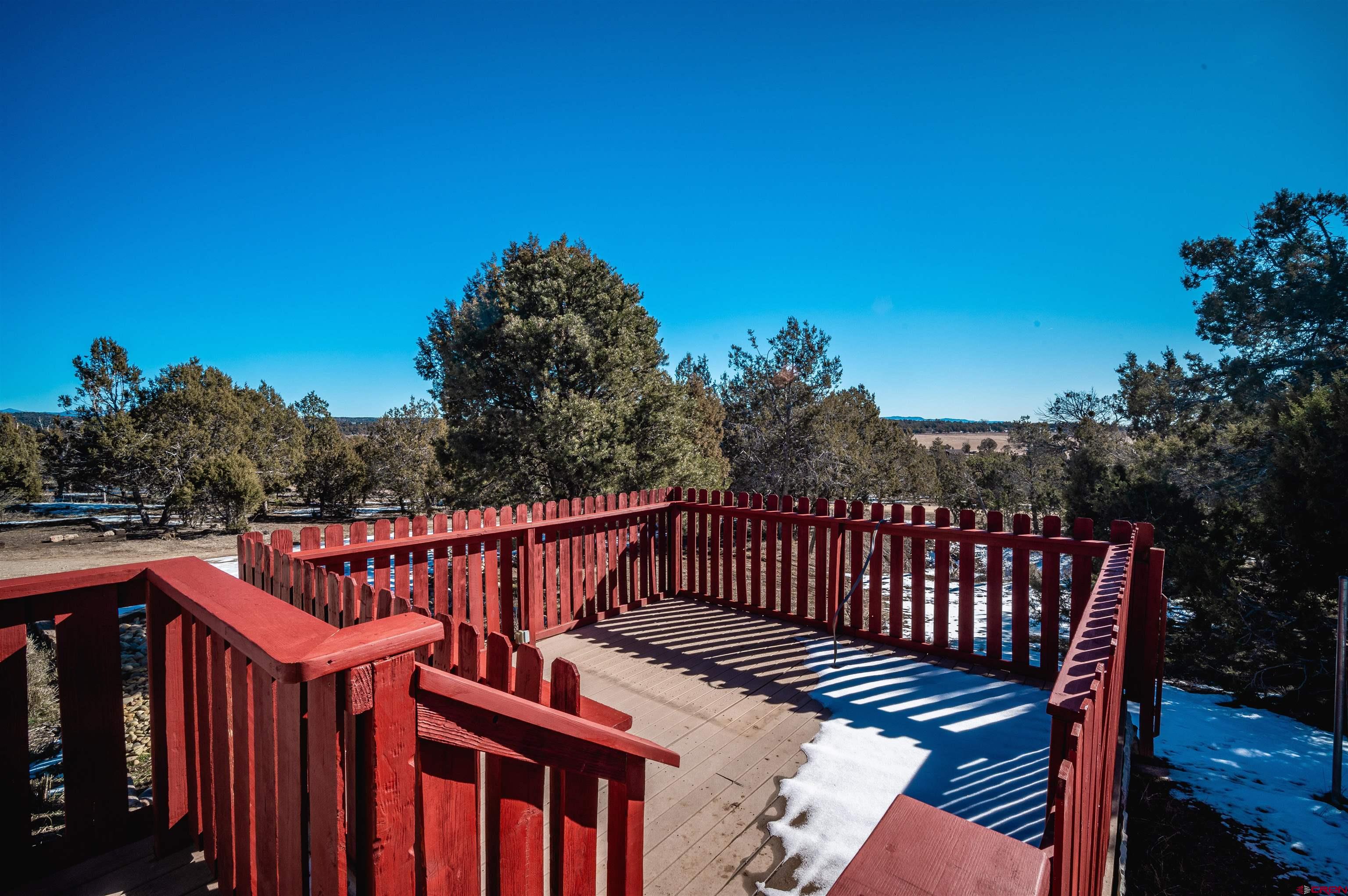 253 Valley Place Durango, CO 81303 - Photo 18 of 26 a view of a roof deck with wooden fence and floor