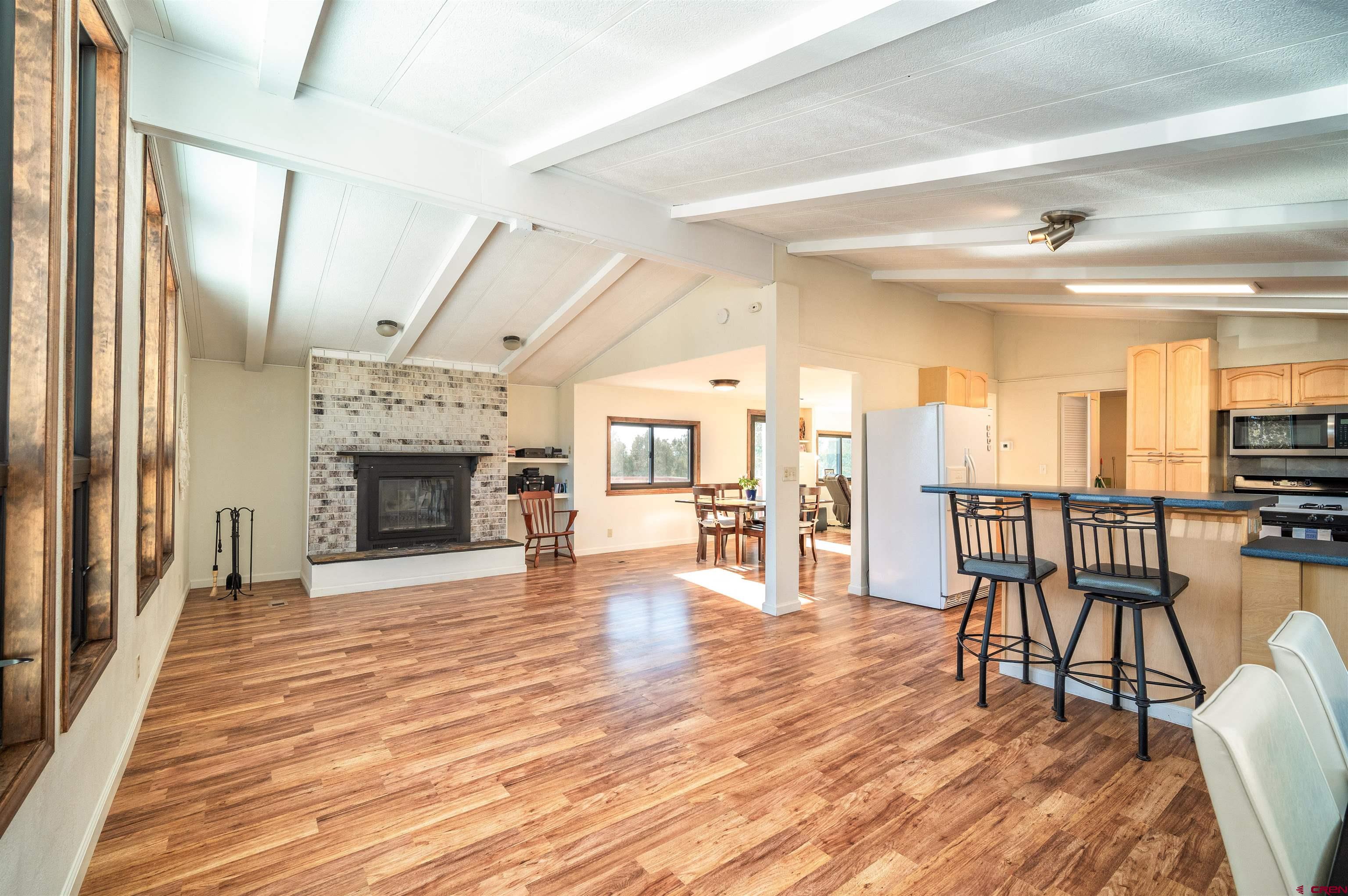 253 Valley Place Durango, CO 81303 - Photo 5 of 26 a view of a livingroom with furniture and a fireplace