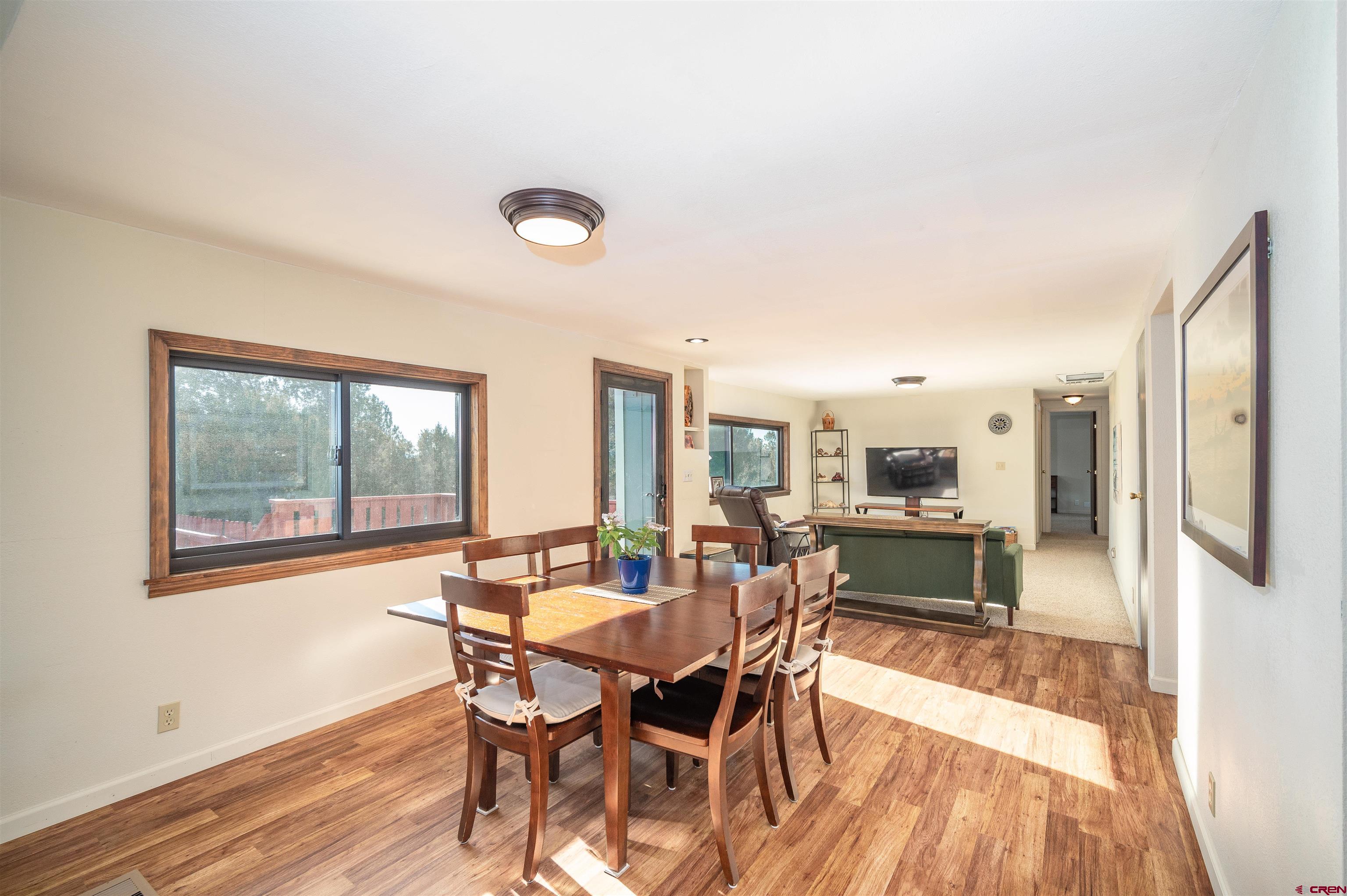 253 Valley Place Durango, CO 81303 - Photo 8 of 26 a dining room with furniture a rug and wooden floor