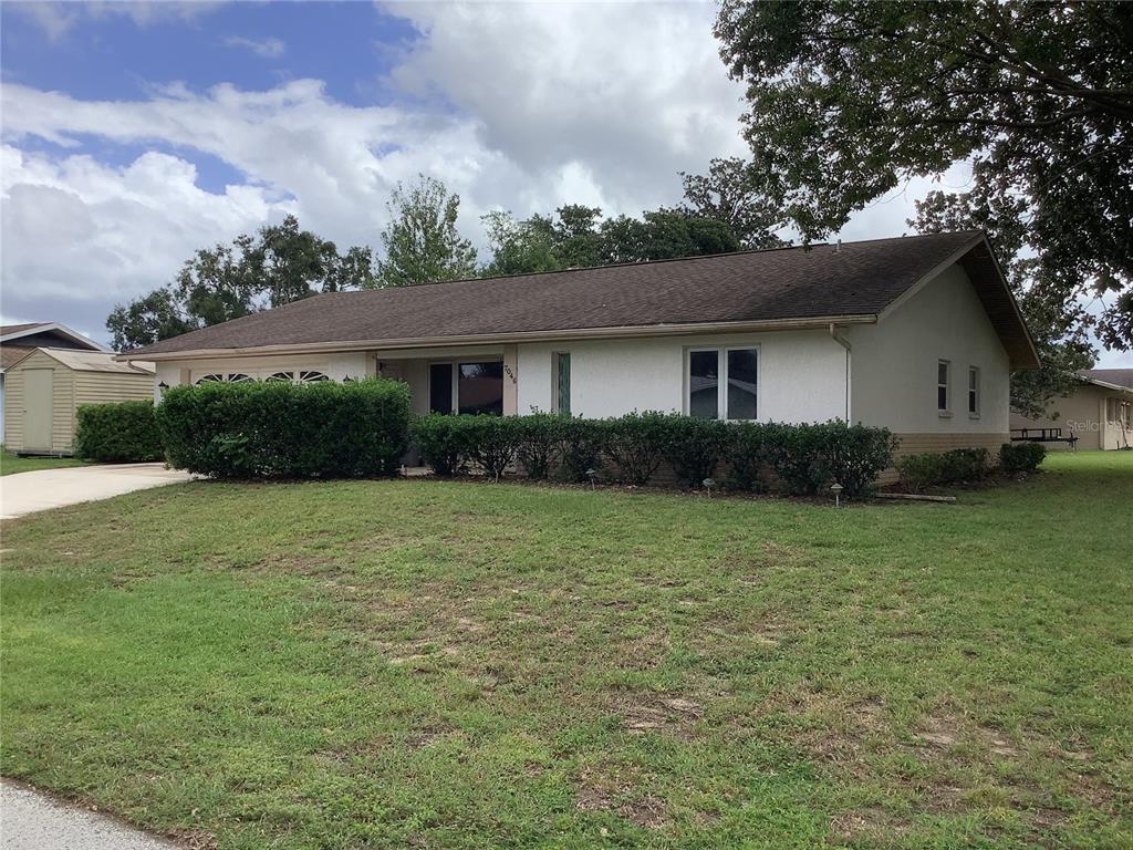 7046 Windmere Road Brooksville, FL 34602 - Photo 1 of 1 a house view with a garden space