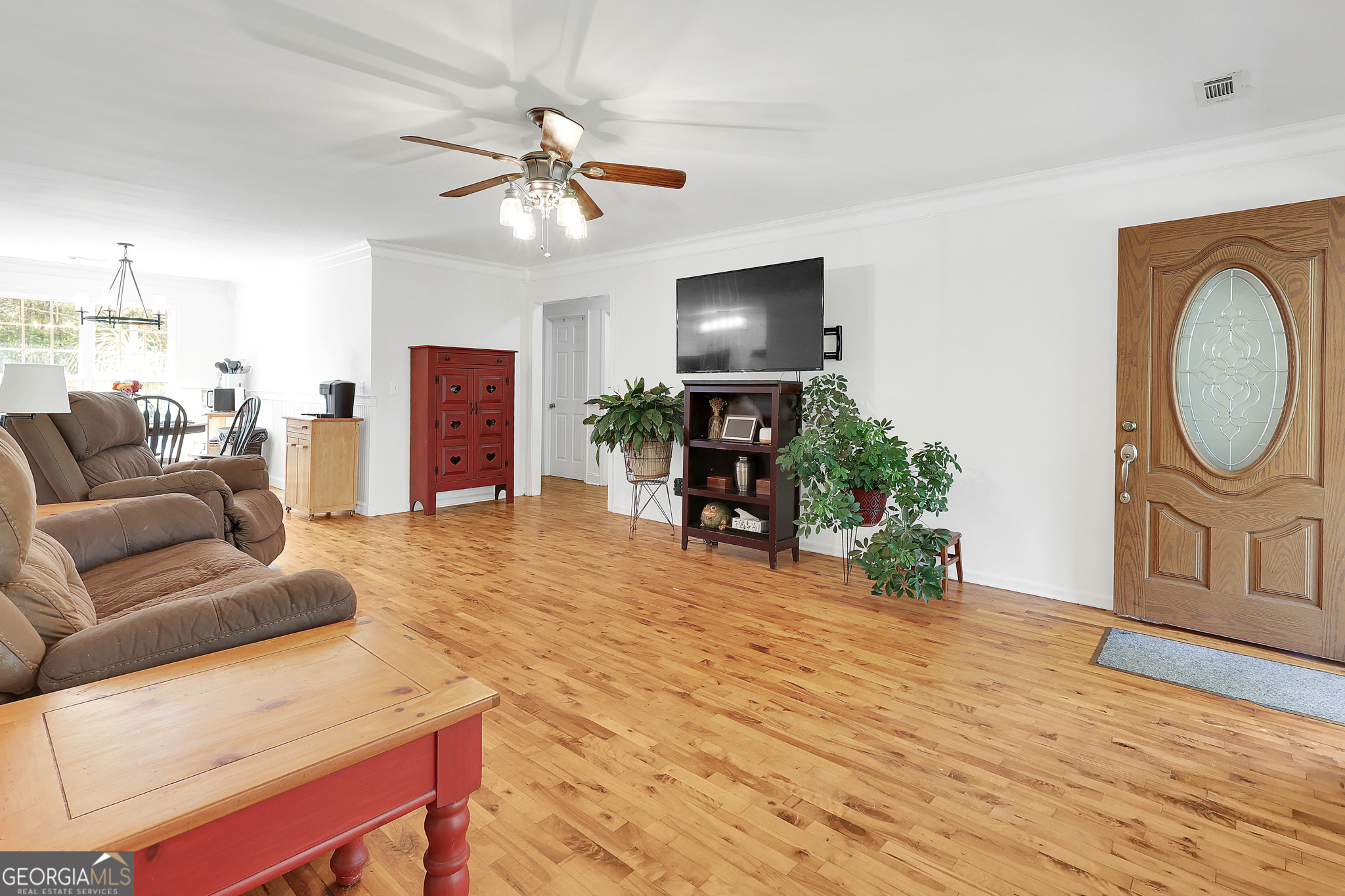 394 Burg Road Locust Grove, GA 30248 - Photo 15 of 40 a living room with furniture a fireplace and a flat screen tv