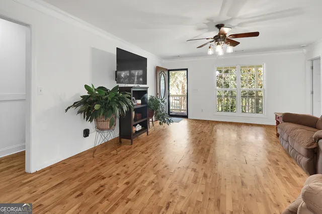 a view of livingroom with furniture window and wooden floor