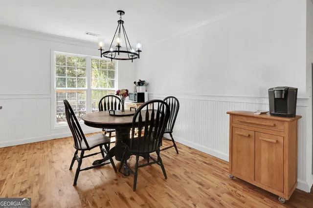 a dining room with furniture window wooden floor