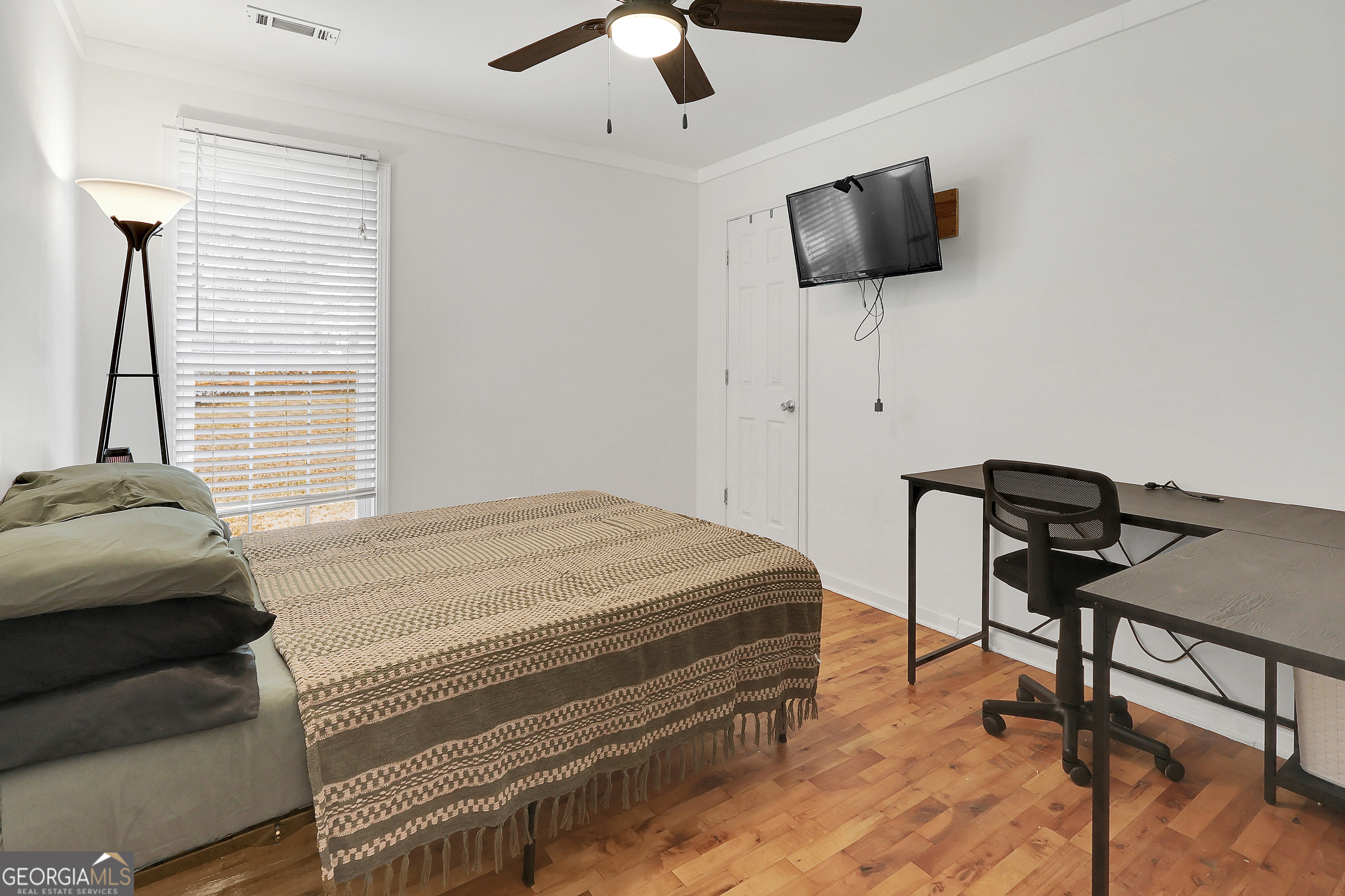 394 Burg Road Locust Grove, GA 30248 - Photo 27 of 40 a bedroom with a bed and a television