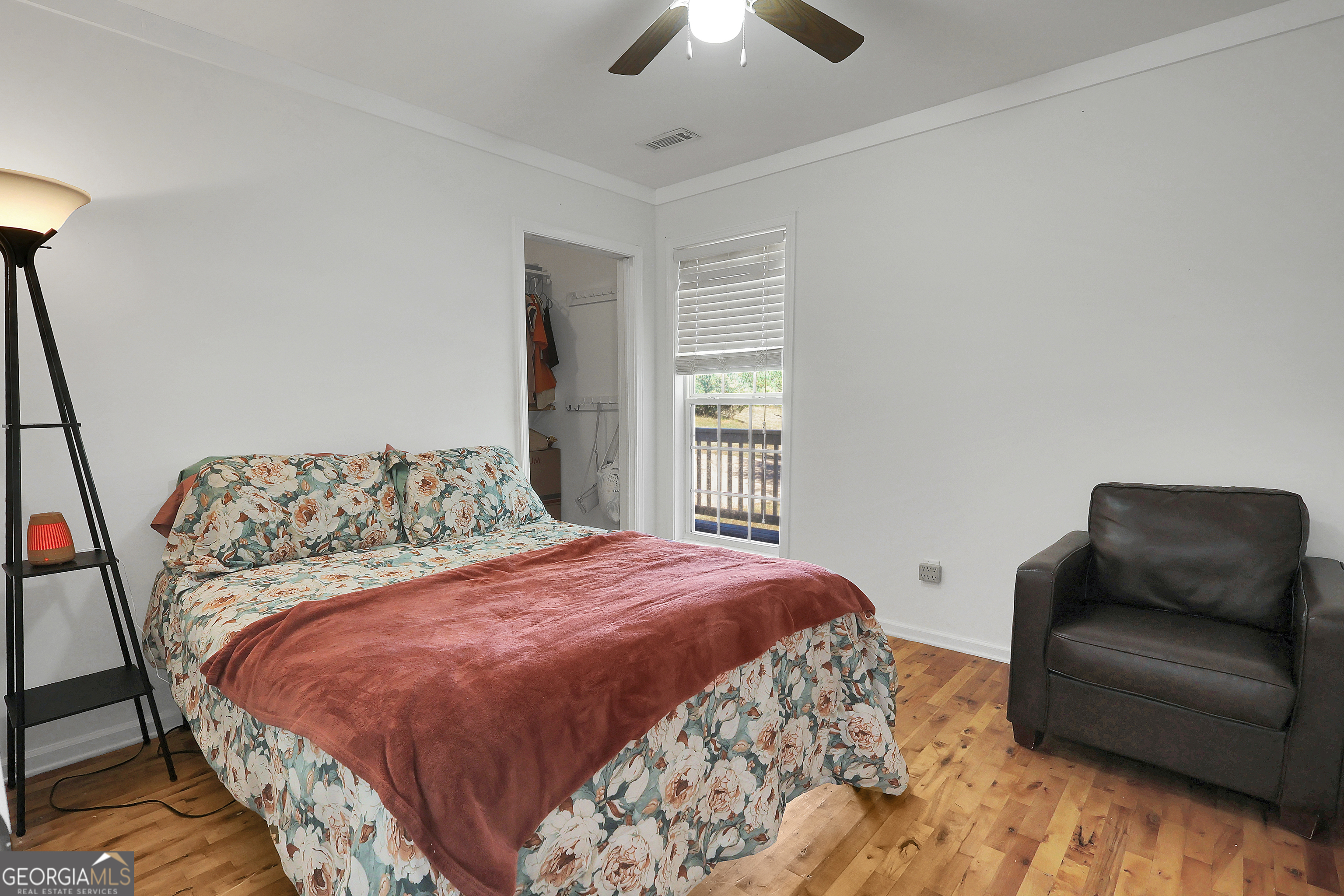 394 Burg Road Locust Grove, GA 30248 - Photo 28 of 40 a bedroom with a large bed and a couch