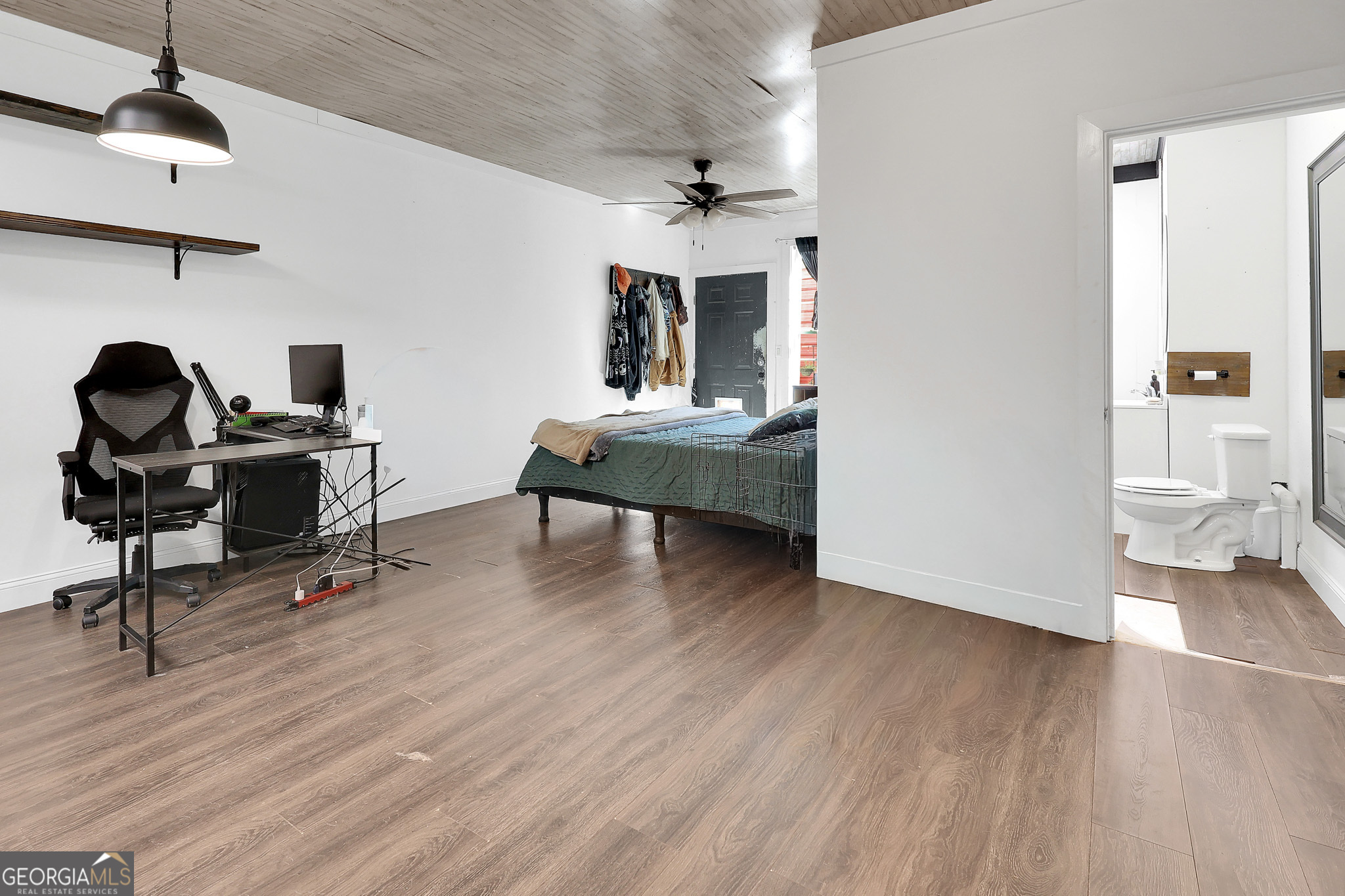 394 Burg Road Locust Grove, GA 30248 - Photo 32 of 40 a view of a workspace with furniture and wooden floor