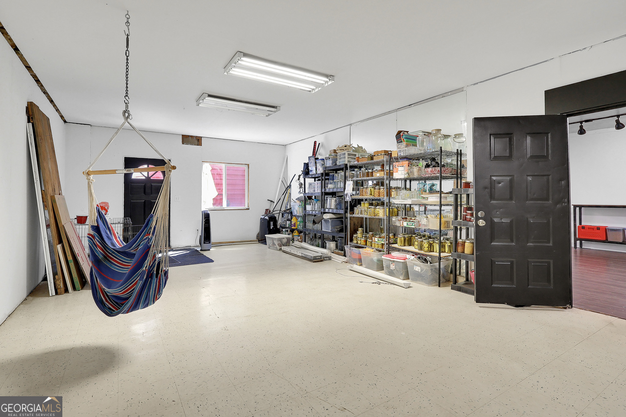 394 Burg Road Locust Grove, GA 30248 - Photo 37 of 40 a view of a room with gym equipment