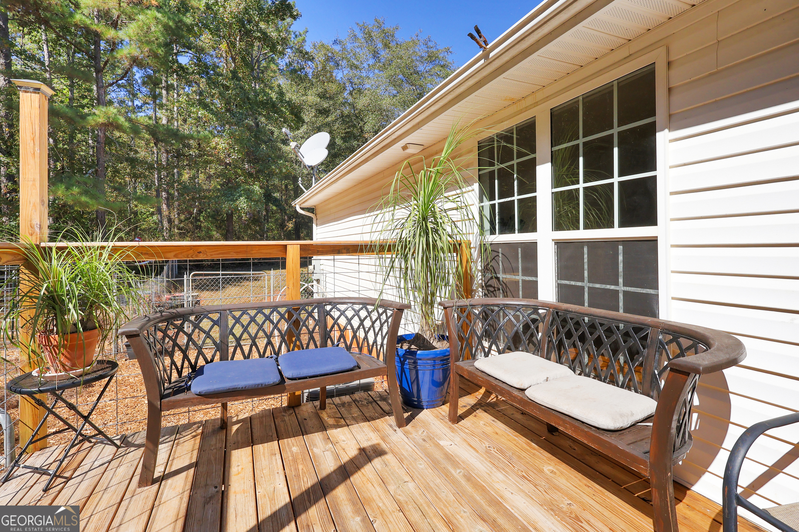 394 Burg Road Locust Grove, GA 30248 - Photo 4 of 40 a view of two chairs in the balcony