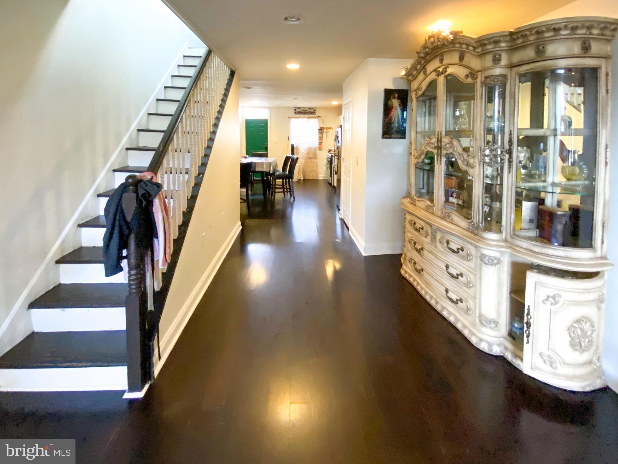 3018 East Fayette Street Baltimore, MD 21224 - Photo 2 of 2 a view of entryway and hall with wooden floor