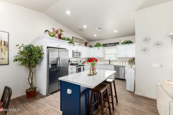 a kitchen with a sink stove and refrigerator