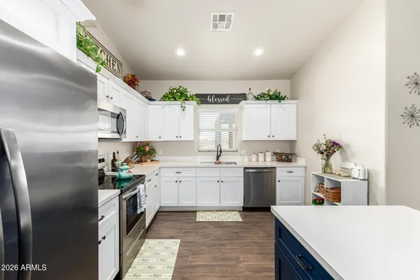a view of living room filled with furniture and wooden floor