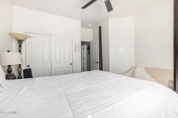 a bedroom with a bed and a tv in it