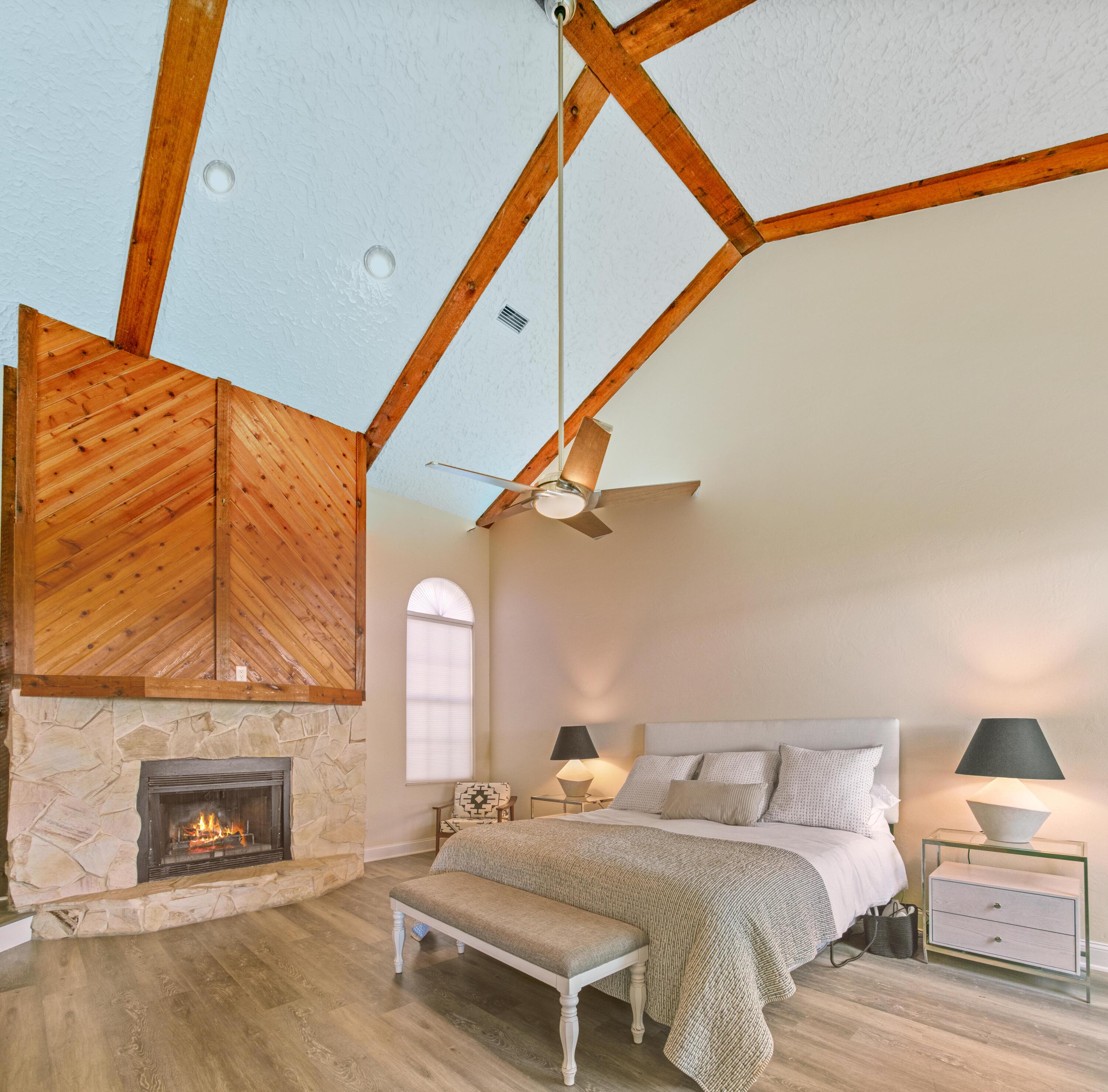 41 Waterview Place Freeport, FL 32439 - Photo 22 of 74 a bedroom with a bed and a fireplace